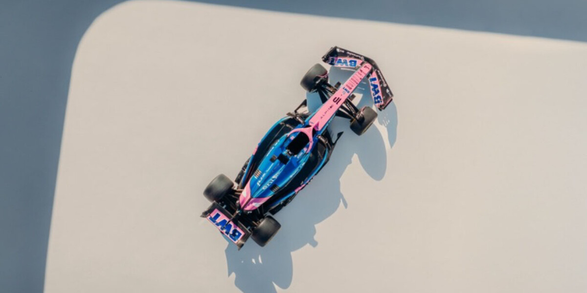 A high-resolution overhead shot of the Alpine Formula 1® 2025 race car in striking blue and pink livery.