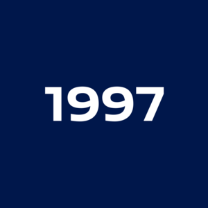 White, bold number 1997 on a dark blue background.