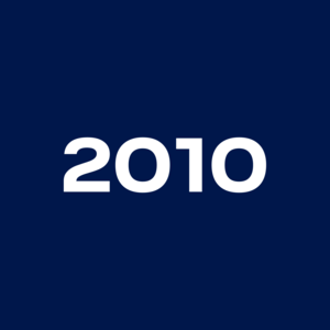 The image shows the white number sequence '2010' centered on a dark blue background.