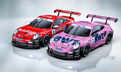Two Porsche 911 GT3 Cup cars are showcased in a studio setting, featuring vibrant BWT and Windhagerlivery.