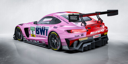 A high-performance Mercedes-AMG GT3 race car, featuring a striking pink and blue BWT livery.