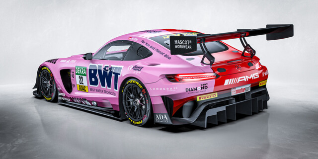 A high-performance Mercedes-AMG GT3 race car, featuring a striking pink and blue BWT livery.